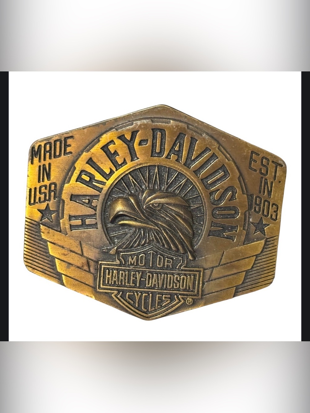 vintage brass Harley-Davidson eagle belt buckle featuring a raised eagle design